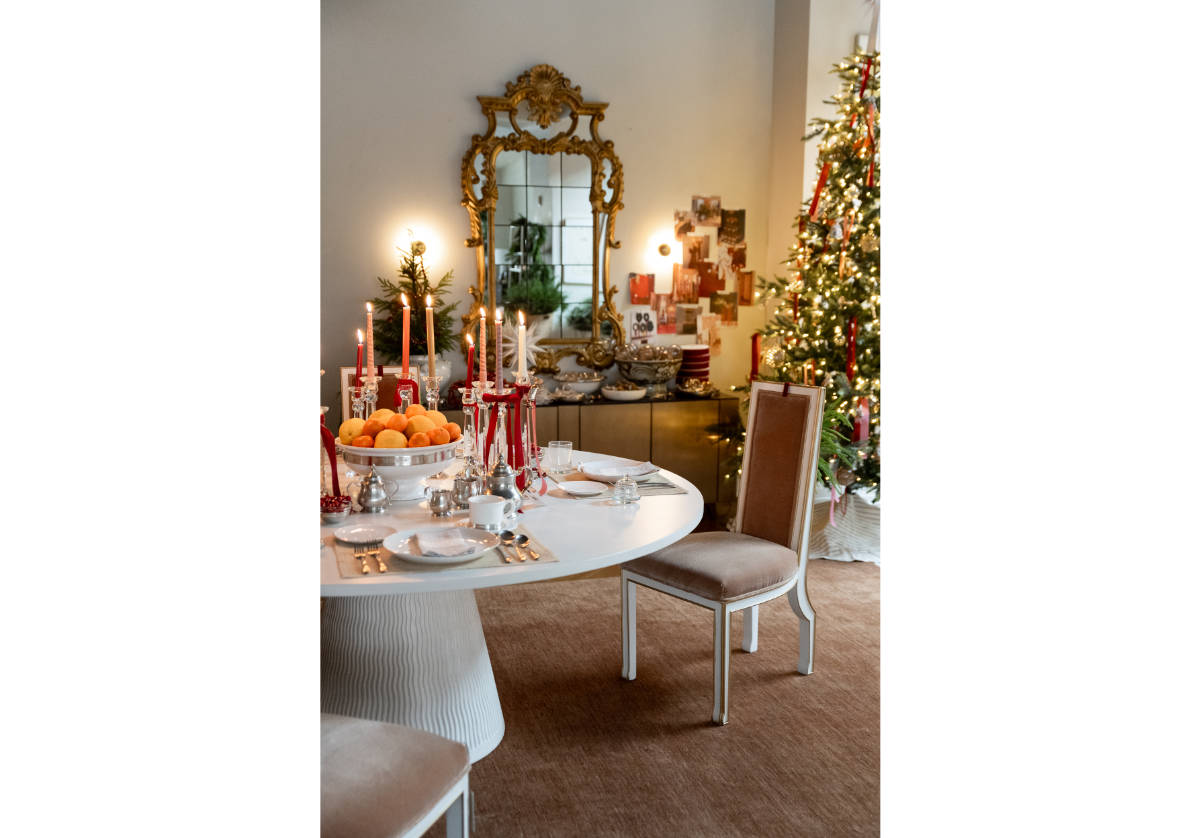 the lucca dining table can be seen with the  felix chair sitting off to the side of the table and in front of the christmas tree. 