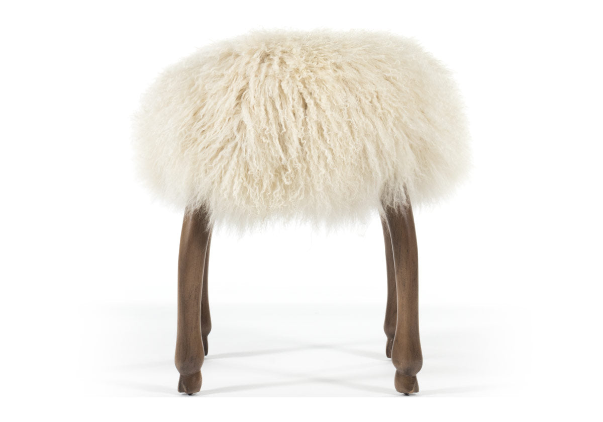 photo of front of fifi stool, accent stool with its long, luxurious Mongolian sheepskin seat elevated by four animal hoof feet.