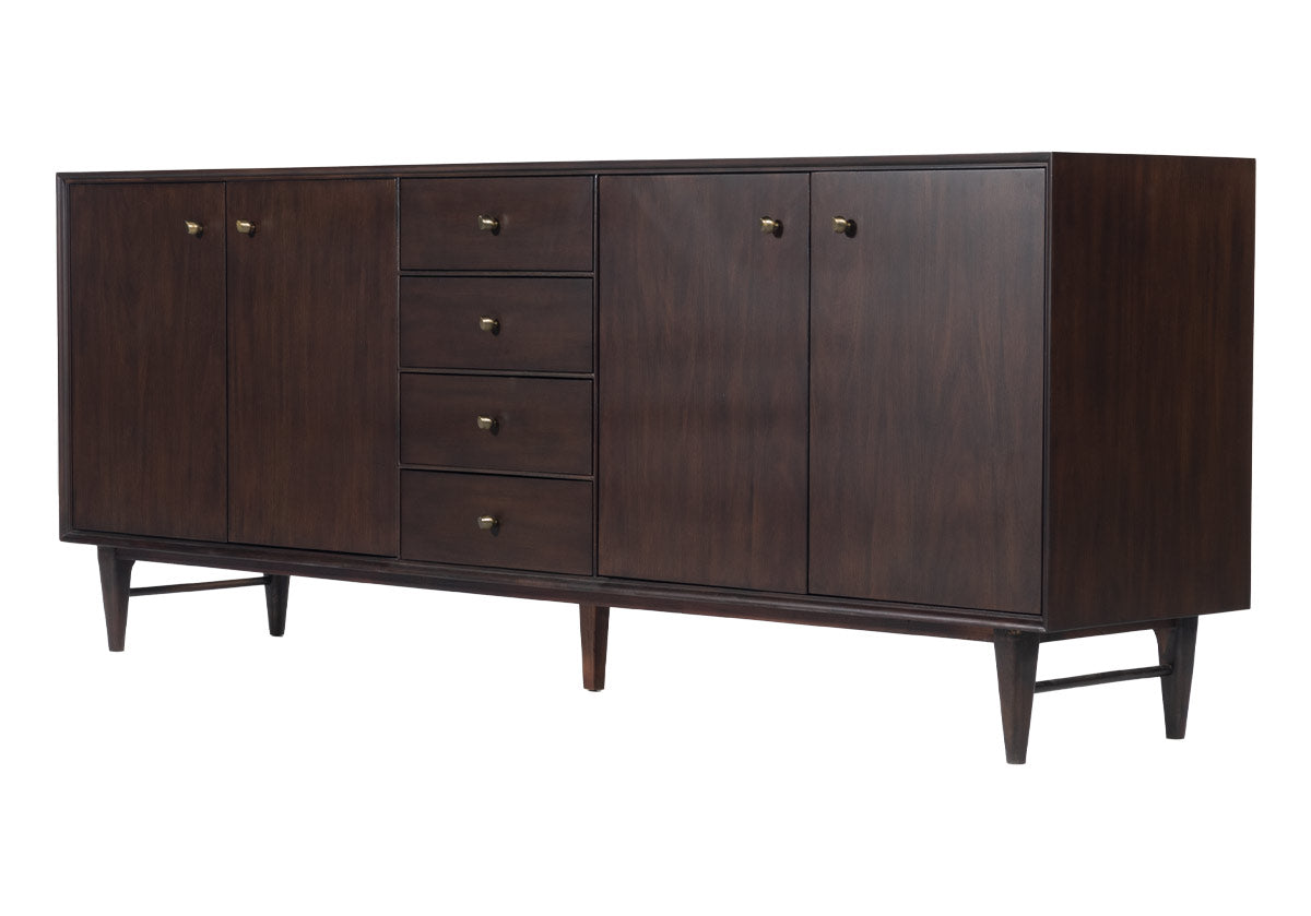 The Frank Sideboard gives an elevated, mid-century feel with its handsome design. Its dark mahogany box, doors, and drawers add a rich sophistication to any room. Organic-shaped bronzed knobs provide additional dimension complemented by ample hidden storage. Style in a living room, dining room, office, or bedroom for a one-of-a-kind design.