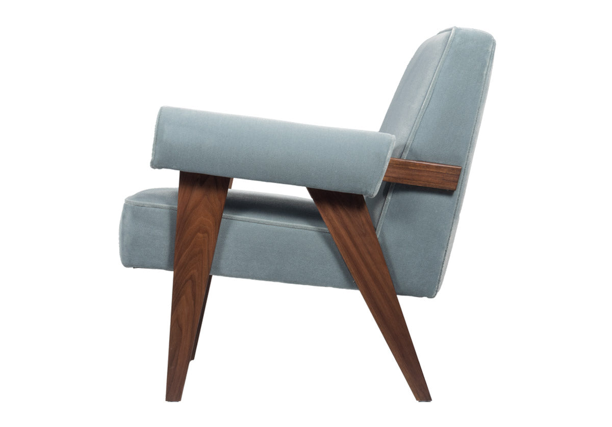 a walnut-stained luxurious chair for living room complemented by comfortable Capri Blue faux mohair upholstery