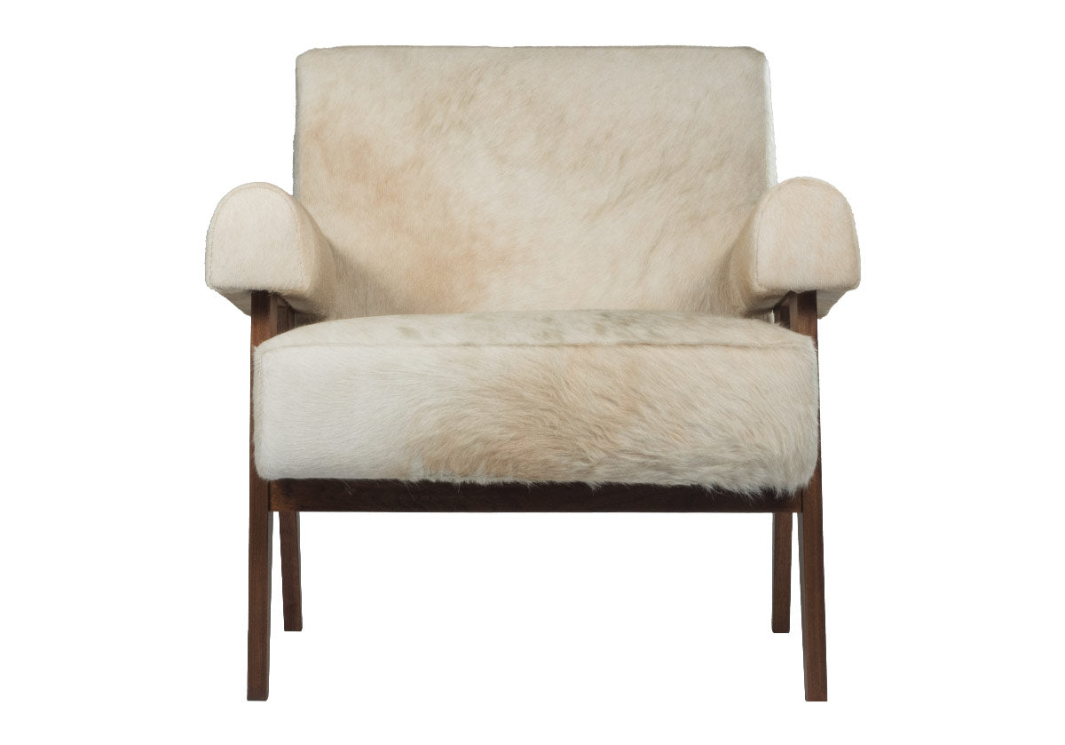 Jude lounge chair showcases a walnut-stained frame complemented by an ultra luxe hair-on-hide upholstery. white and tan cowhide chair