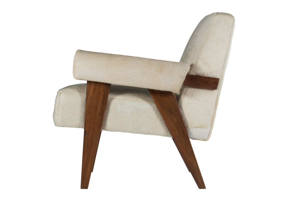 side view of Jude lounge chair a walnut-stained frame complemented by an ultra luxe hair-on-hide upholstery. white and tan cowhide chair