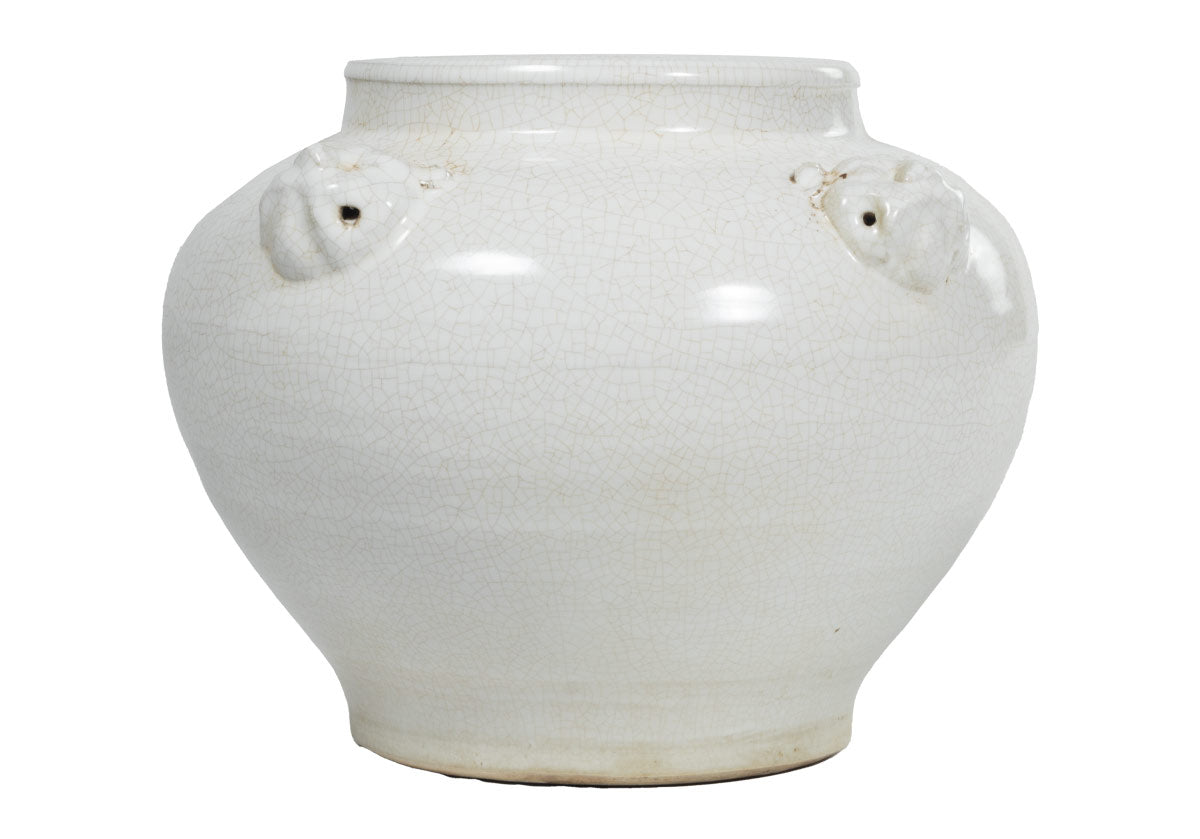 large, white jar named agnes with tiny holes on the sides 