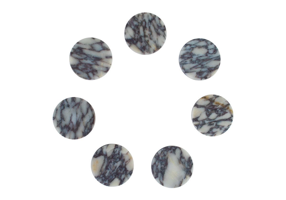 7 marble coasters placed in a circle made of calacatta viola 