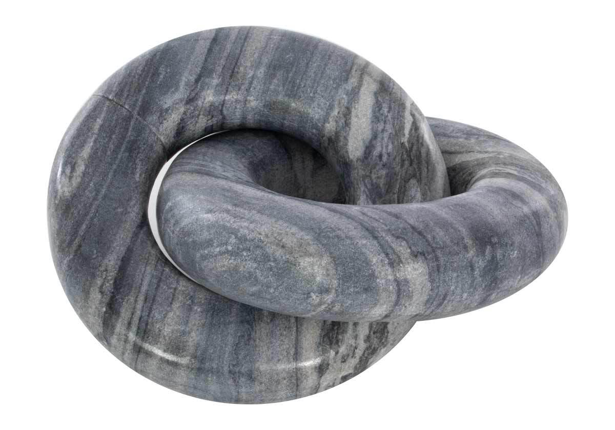 studio photo of the komo knot made from dark marble . Tasteful and dimensional, the Como Knot features a beautiful, smooth marble form. Distinctive veining and patterning lend a unique, visually textured look to each knot. Its interlocking form styles well on built-ins, trays, or tables.