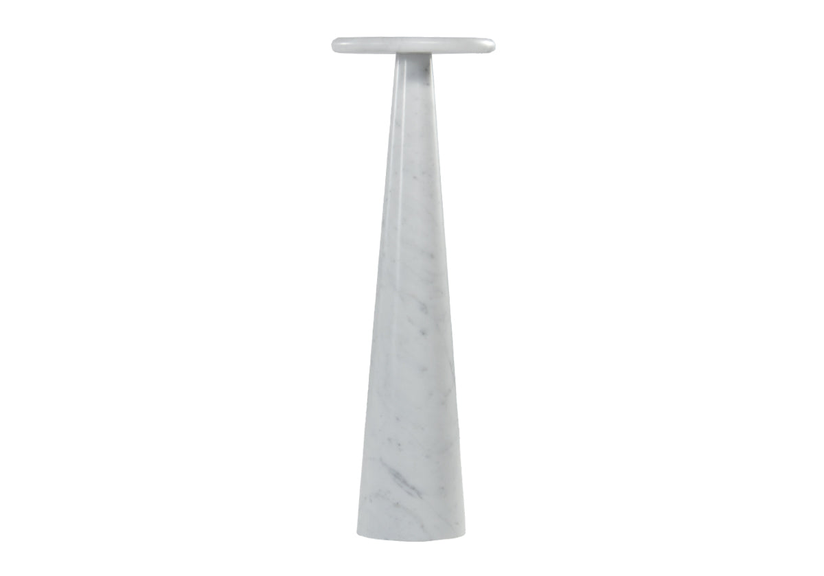 Carved from Carrara White marble, its tapered pedestal base is complemented by a petite bullnosed edge to