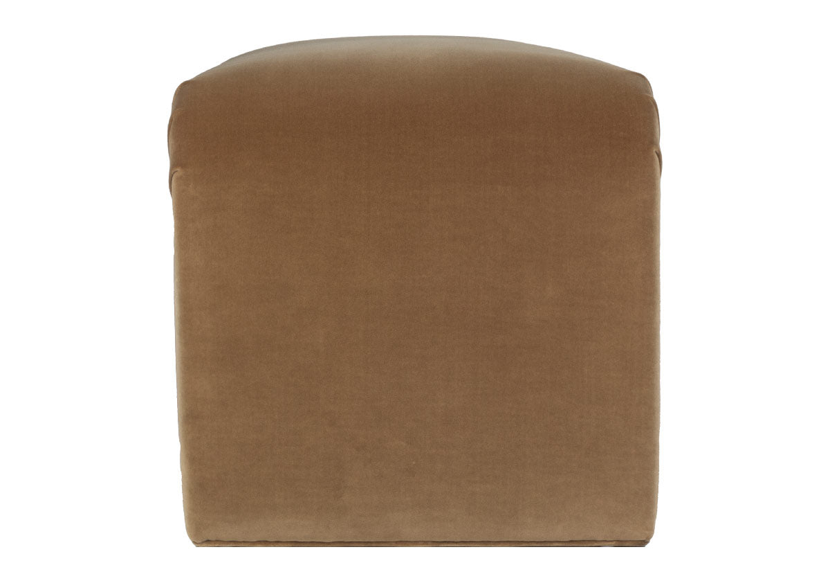 the phoebe bench is a luxurious italian cotton velvet chair, adding a touch of elegance and sophistication to any home. A soft brown colored velvet bench. The clean lines and sculptural form create a striking visual impact, while the curved edges offer a comfortable and inviting seat. Perfect for adding a pop of color and a touch of vintage flair to your living room, bedroom, or entryway.