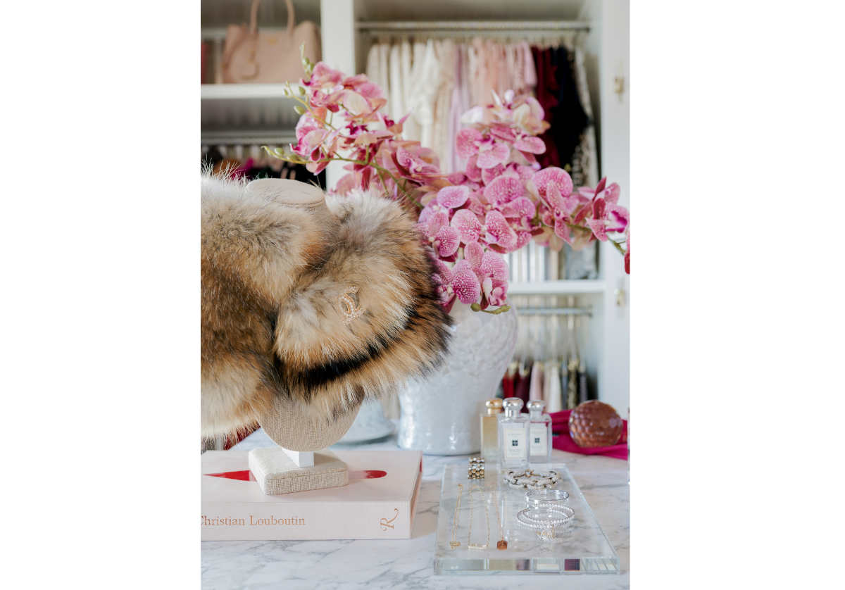 pink orchids and crystal slab decorate this closet.