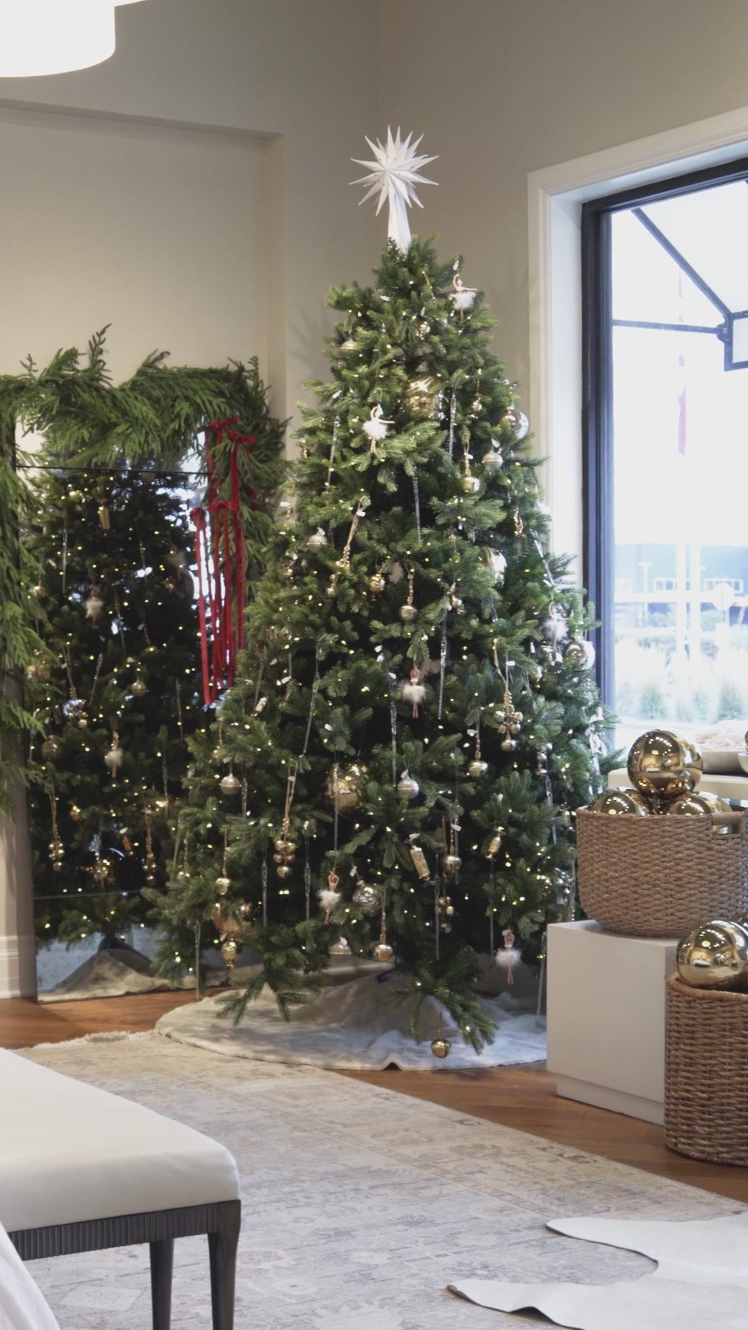 video of alice lane christmas tree draped in warm christmas lights golden magnolia ornaments, silver and gold christmas decor.