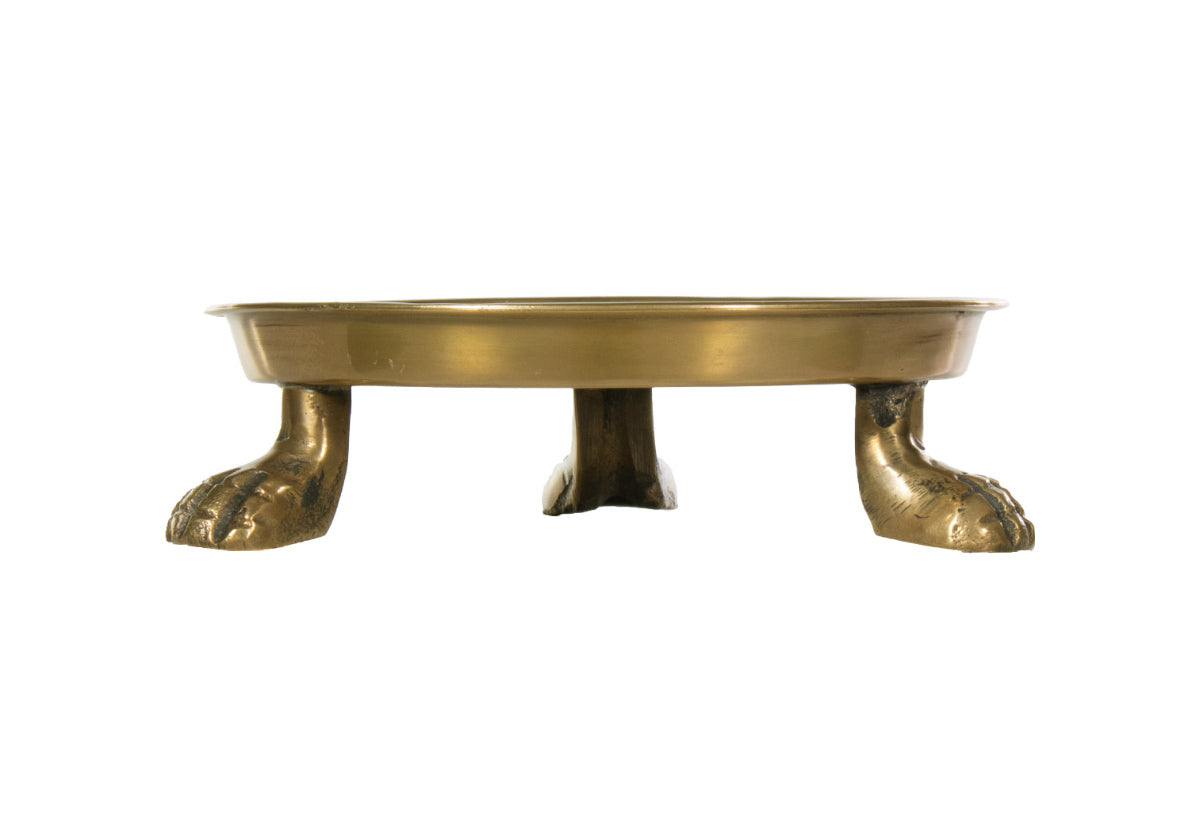 An Alice Lane favorite, this round clawfoot dish is crafted from brass and steel. Its eye-catching lion paw legs represent strength and leadership with balanced thought, action, and emotion. Incredibly versatile, it easily styles as a catchall, candle dish, or decor piece. Its symbolic meaning makes a luxurious, thoughtful gift for anyone.