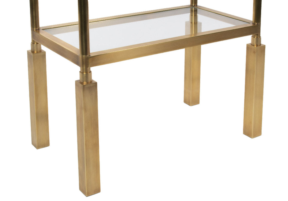 close up of the legs on the brass beatrice etagere. 