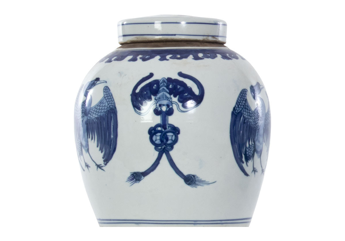 medium crane jar studio with lid on and floral designs. 