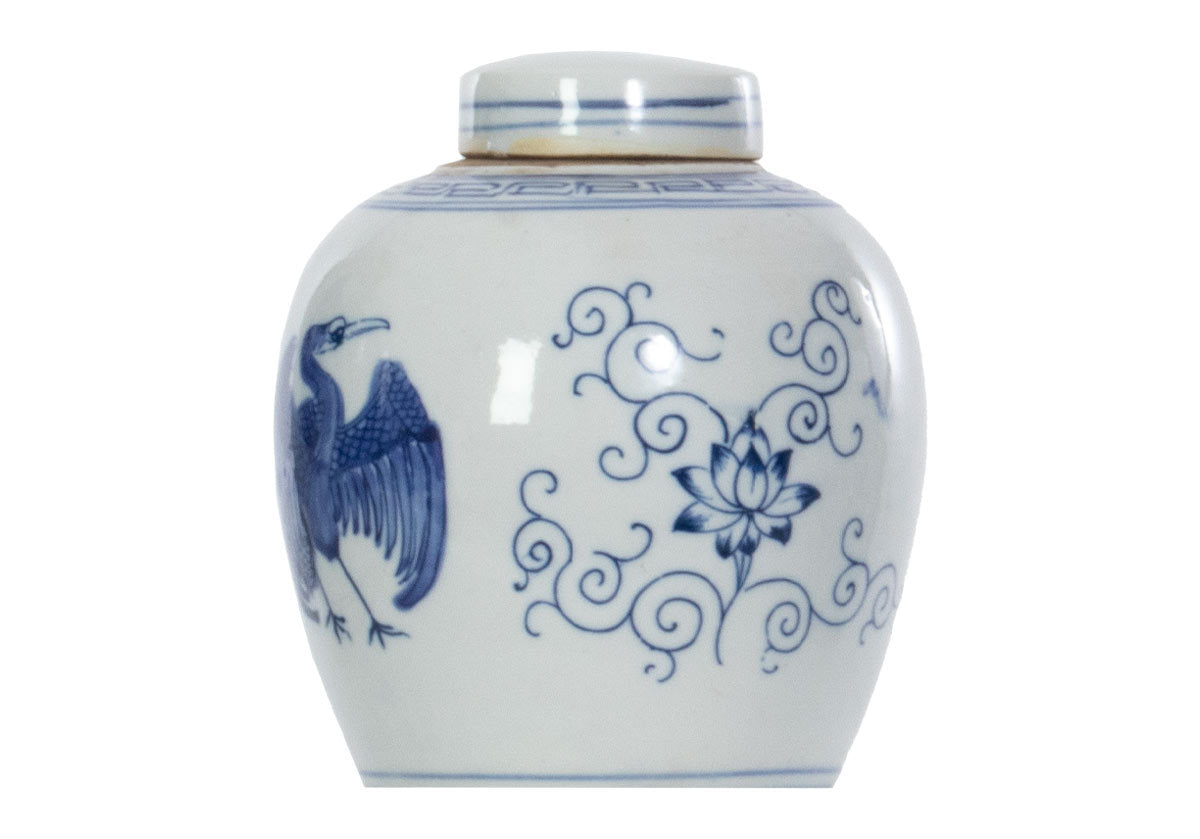 medium crane jar with floral design on the side. 