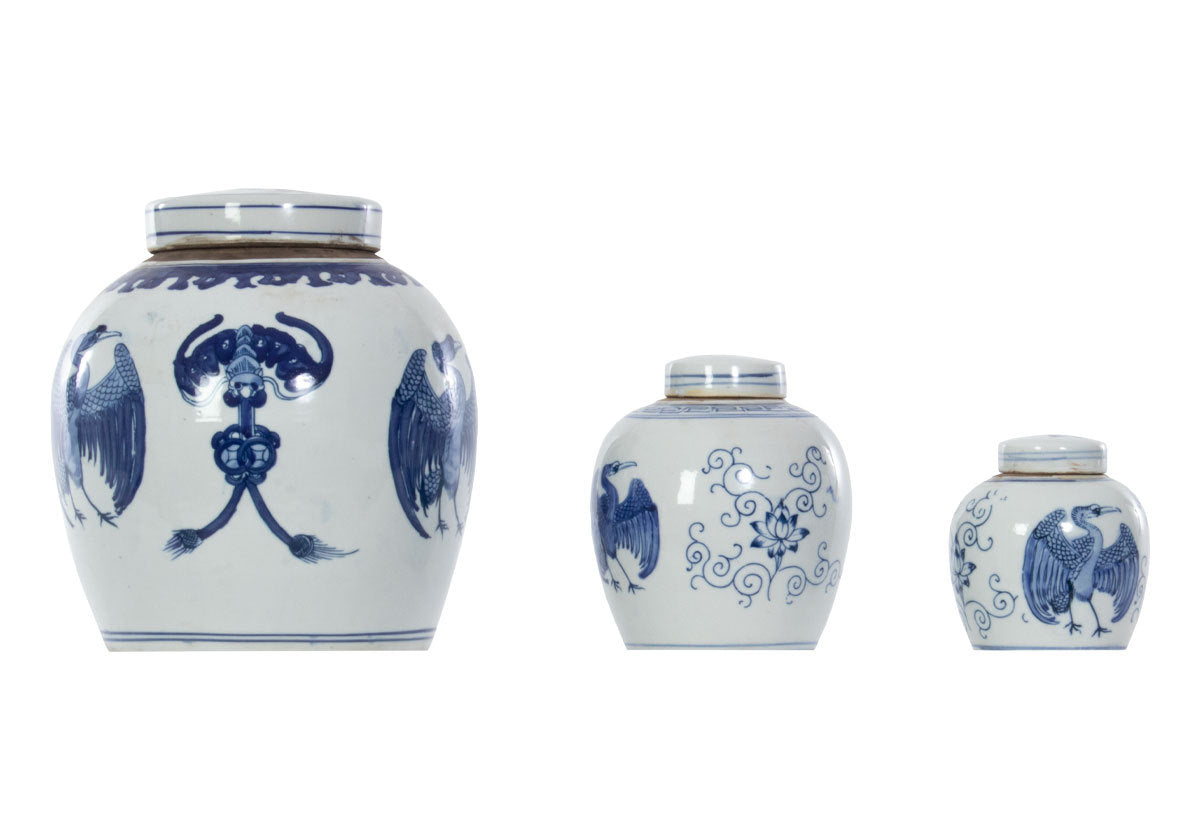 crane temple jars pictured together, small, medium and large temple jars with blue and white crane and floral designs. 