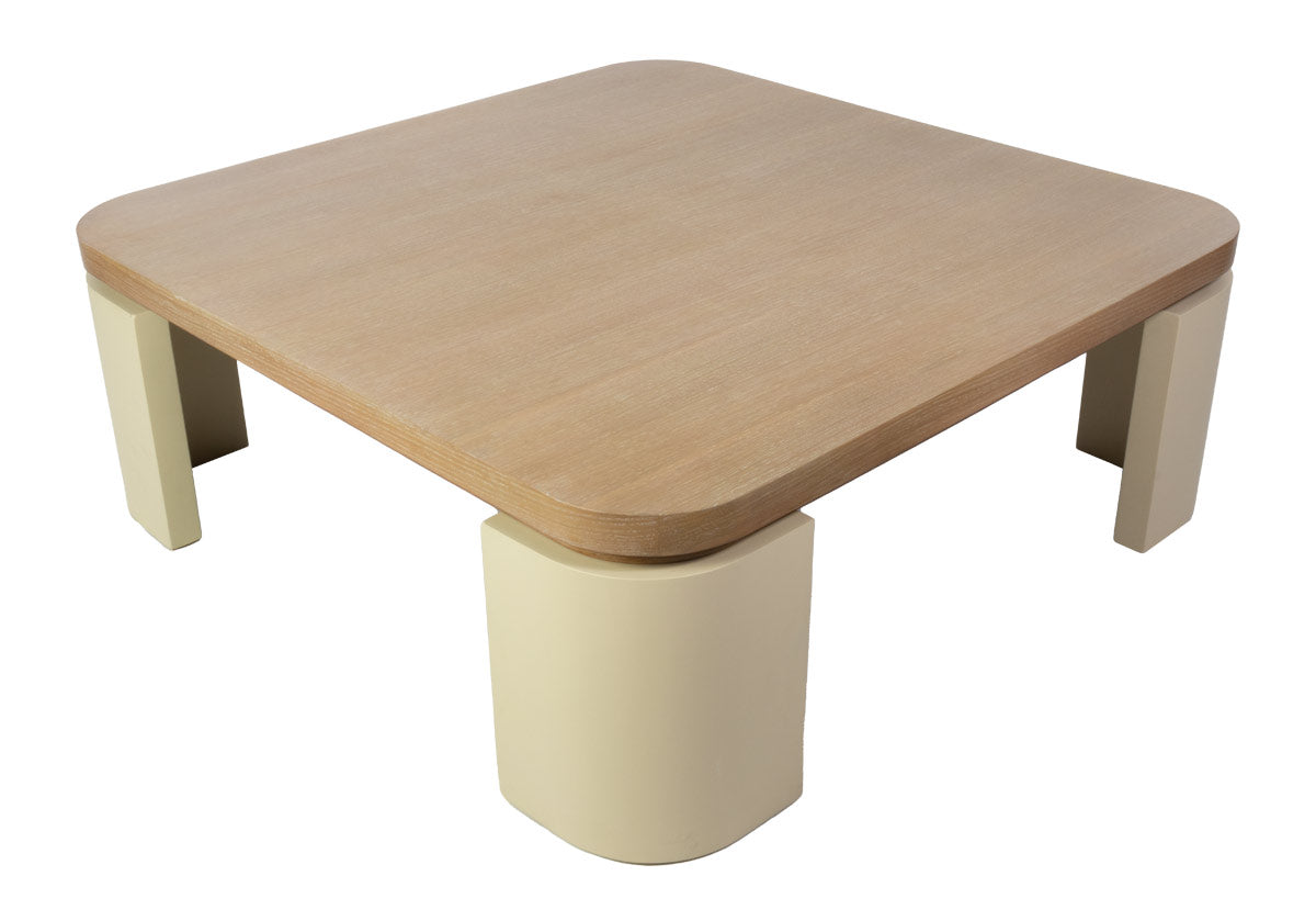 top down photo of the blair cocktail that makes a sculptural statement with its spacious white oak top elevated by four radius legs. The natural wood graining and patterning provide a beautiful contrast to its smooth, creamy base for an elevated design.