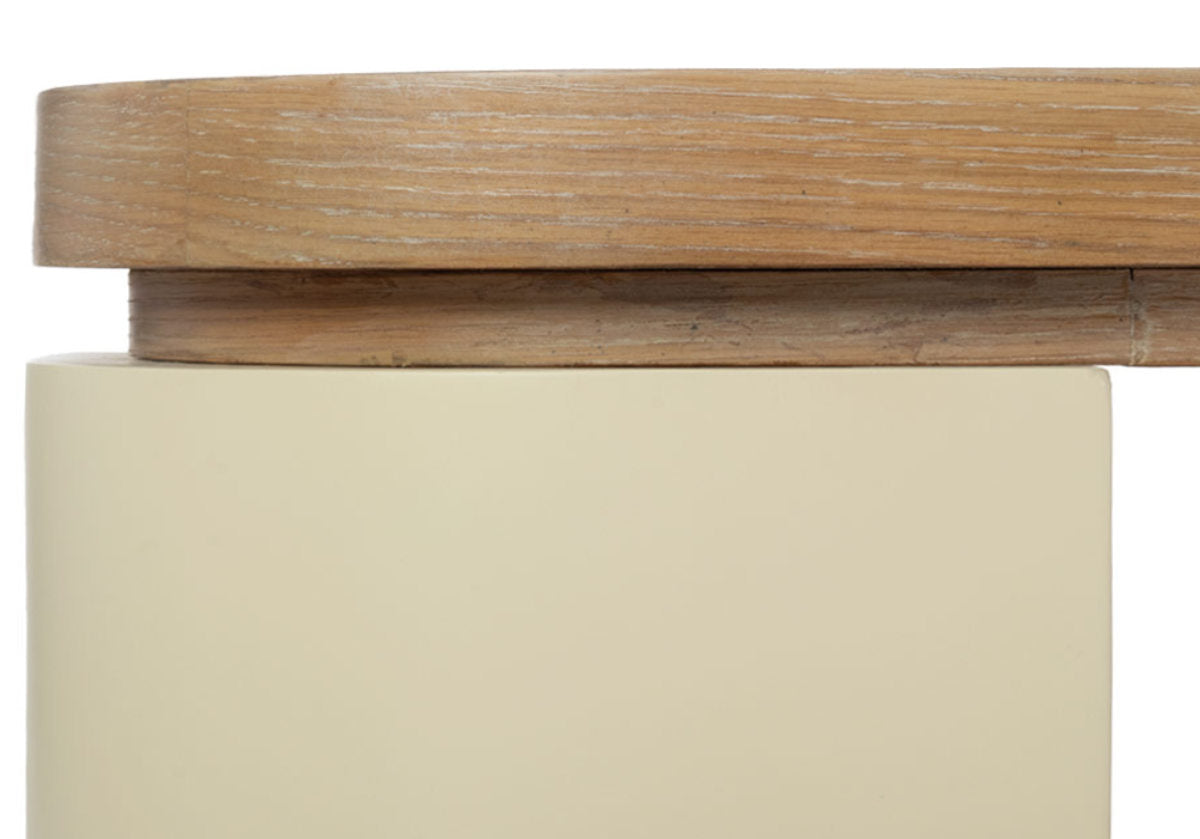 close up photo of the blair cocktail that makes a sculptural statement with its spacious white oak top elevated by four radius legs. The natural wood graining and patterning provide a beautiful contrast to its smooth, creamy base for an elevated design.