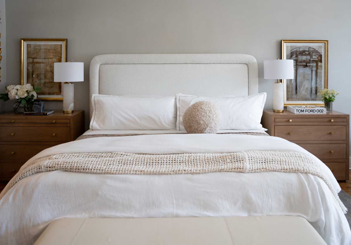 lifestyle photo of the brooklyn nightstands on the left and the right side of the kit bed. each have a lamp on top with different decorative objects. 