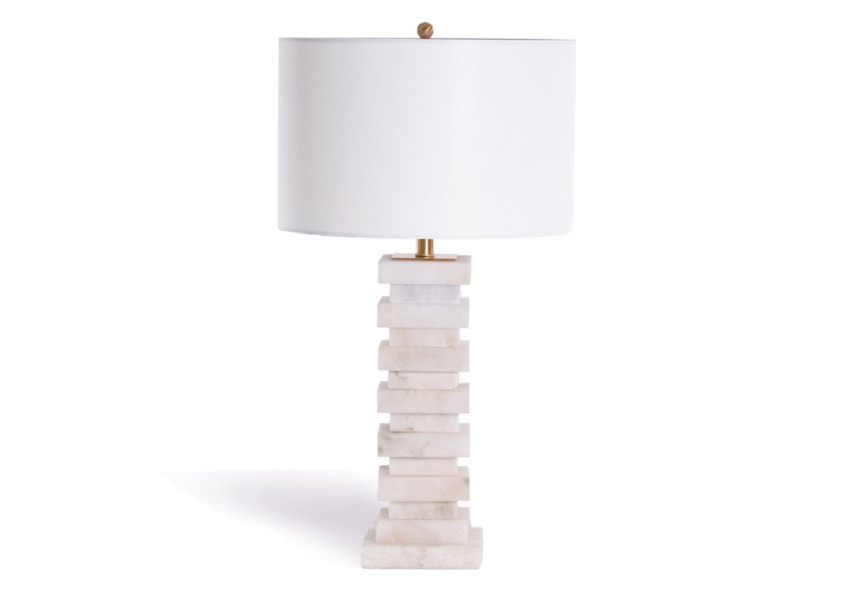 The Chester lends timeless elegance with its dimensional stacked design crafted from natural Alabaster. Its distinct patterning and neutral coloring are complemented by a linen shade and brass hardware, creating a refined, sophisticated lamp.