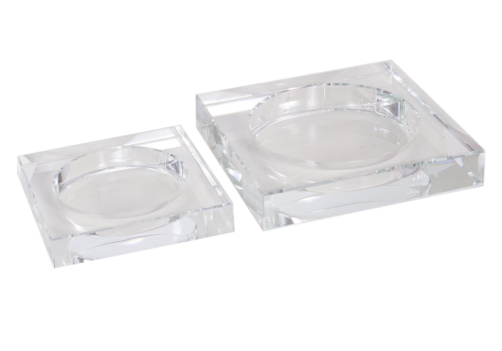 two crystal candle dishes together, one is smaller than the other. 