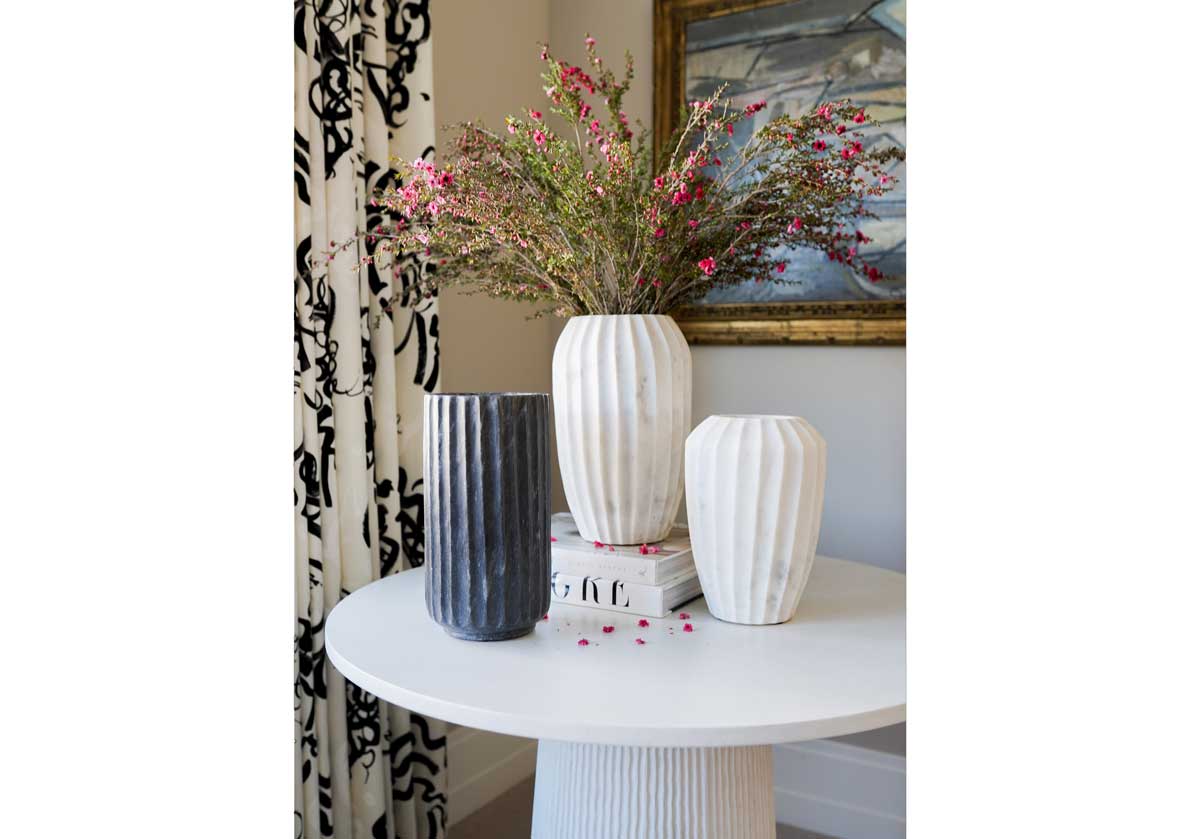 the flora and fauna cases next to each other on the lucca side table. 