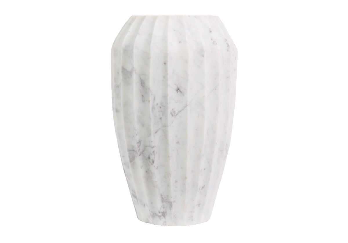 The Flora is an eye-catching vase with its subtle ribbed design crafted entirely from white marble. Its distinctive, natural marble pattern lends visual texture, for an effortlessly versatile piece. Available in two sizes, style one alone or pair both together for added height and refinement.