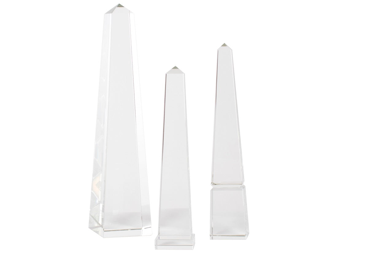 three different sized crystal obelisks next to each other - small, medium, large. 